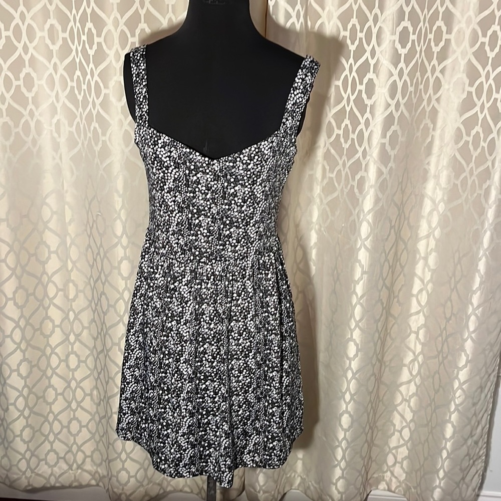 Black top with white and gray flowers from BeBop Size M